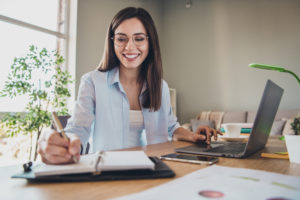 Young female professional completing online training