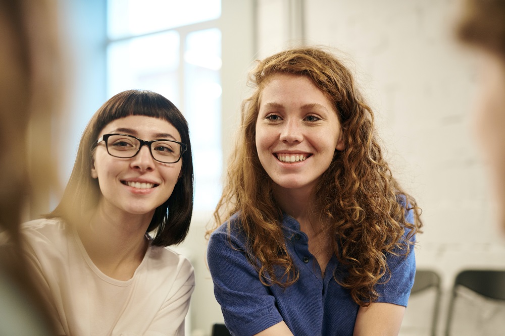 Two young people smiling