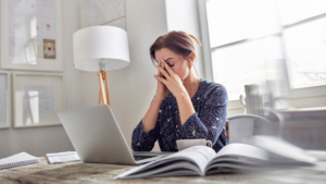 Person stressed and overwhelmed in the workplace