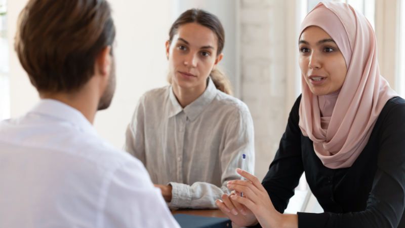 HR professionals sat having a discussion