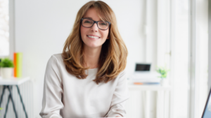 Professional woman, smiling at camera