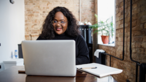 Young person performing research on laptop