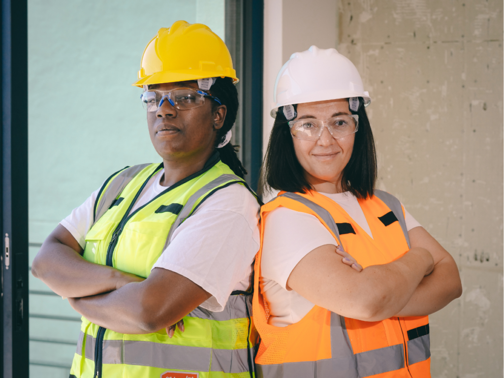Two women on a construction site wearing PPE