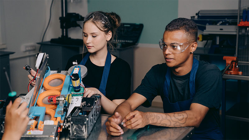 Man and Woman Inside a Factory