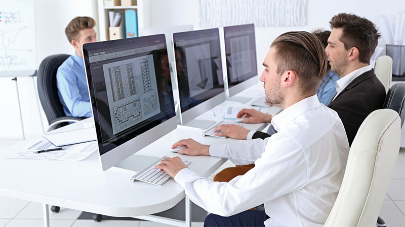 Engineers working on computers